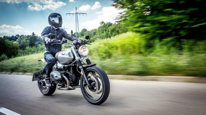 motorcycle riding down a street